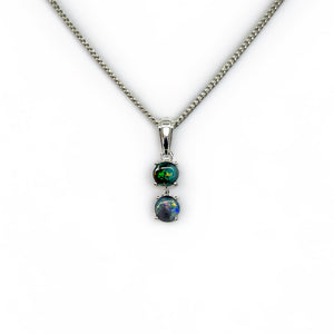 A Lightning Ridge black opal pendant set in 925 sterling silver. The pendant features two opals, the upper being smaller and both claw-set, exhibiting a spectrum of vibrant colors. It hangs from a silver-plated chain, included with the pendant. | Fremantle Opals